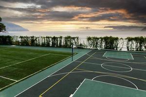 Outdoor Volleyball court with a net in the morning next to the sea. photo