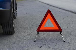 An emergency stop sign for a vehicle is installed on the road. Copy space. photo