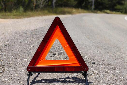 An emergency stop sign for a vehicle is installed on the road. Copy space. photo