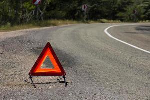 An emergency stop sign for a vehicle is installed on the road. Copy space. photo