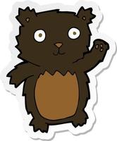 sticker of a cartoon waving black bear cub vector