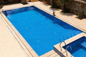 Outdoor pool with blue water without people. photo