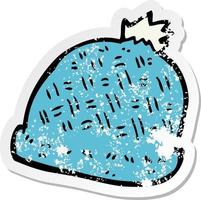 retro distressed sticker of a cartoon winter hat vector