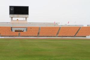 bleachers with green field background photo