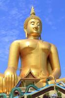 Big Buddha image on blue sky background photo