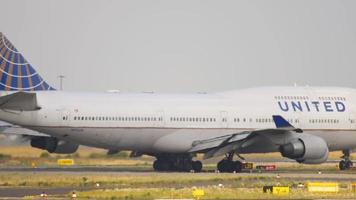 FRANKFURT AM MAIN, GERMANY July 18 2017 - United Airlines Boeing 747 taxiing to runway for departure. video