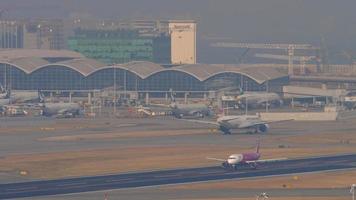 HONG KONG NOVEMBER 10, 2019 - Airbus A320 of Peach departure at Hong Kong airport. Peach low cost Japanese airline. Cinematic shot of an airplane take off, climb video