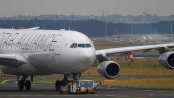 FRANKFURT AM MAIN, GERMANY JULY 17, 2017 - Lufthansa Airbus 340 D AIFF, Star Alliance livery towing from service. Fraport, Frankfurt, Germany video