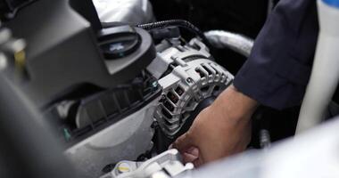 Close up of Asian Man mechanic inspection shine a torch car engine checking bug in engine. Service maintenance insurance with car engine. Car service concept. video