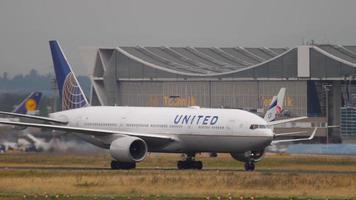 FRANKFURT AM MAIN, GERMANY JULY 20, 2017 - United Airlines Boeing 777 taxiing after landing and El Al Israel Airlines Boeing 737 accelerate before departure. Fraport, Frankfurt, Germany video