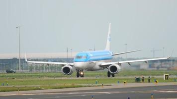 AMSTERDAM, THE NETHERLANDS JULY 25, 2017 - KLM Cityhopper Embraer 190 PH EXA taxis before departure at runway 36L Polderbaan. Shiphol Airport, Amsterdam, Holland video