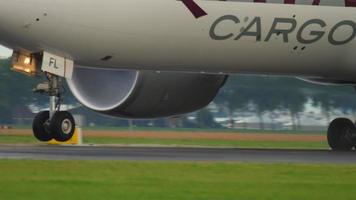 AMSTERDAM, THE NETHERLANDS JULY 24, 2017 - Qatar Cargo Boeing 777 A7 BFL accelerate before departure at Polderbaan 36L, rainy weather, Shiphol Airport, Amsterdam, Holland video