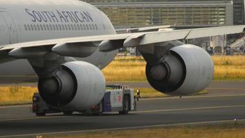 FRANKFURT AM MAIN, GERMANY JULY 17, 2017 - South Afrikan Airways Airbus 340 being towed by tractor from maintenance paring in Fraport video