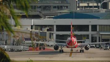 PHUKET, THAILAND NOVEMBER 28, 2016 - AirAsia Airbus A320 HS BBI taxiing after landing, Phuket International airport. video