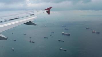 The aircraft descending before landing airport of Singapore, view from the airplane porthole. video