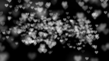 Dynamic background with pulsating hearts on a black background video