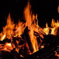 Fire flames on black background, Blaze fire flame texture background, Beautifully, the fire is burning, Fire flames with wood and cow dung bonfire photo