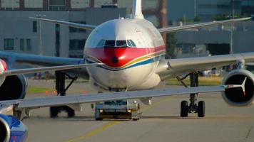 FRANKFURT AM MAIN, GERMANY JULY 21, 2017 - British Airways Airbus 320 G EUPO taxiing and China Eastern Airbus 330 B 5938 towing to service. Fraport, Frankfurt, Germany video