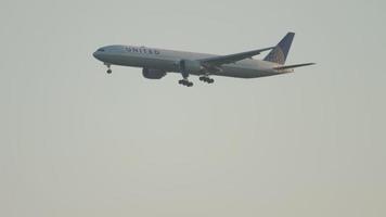 DUSSELDORF, GERMANY JULY 21, 2017 - Long shot of commercial Boeing 777 of United landing at Dusseldorf Airport, Germany. Tourism and travel concept video