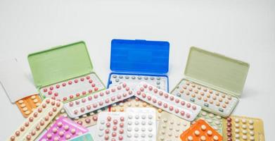 Pile of contraceptive pills in blister pack. Birth control pills. Family planning. Woman hormones tablet pills. Hormone replacement therapy. Pharmaceutical product. Estrogen and progesterone tablets. photo