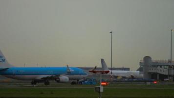 AMSTERDAM, THE NETHERLANDS JULY 27, 2017 - Boeing 737 KLM Royal Dutch Airlines PH BCA towing at early morning, Shiphol Airport, Amsterdam, Holland video