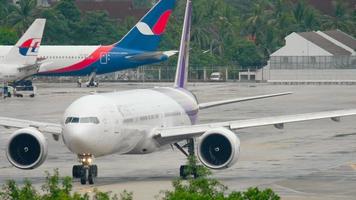 PHUKET, THAILAND NOVEMBER 26, 2016 - Thai airways Boeing 777 HS TKK taxiing before departure Phuket airport. video