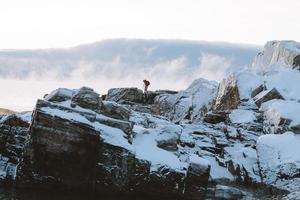 Person hiking on a snowy mountain photo