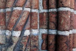 Old brick wall. Texture of old weathered brick wall panoramic background photo