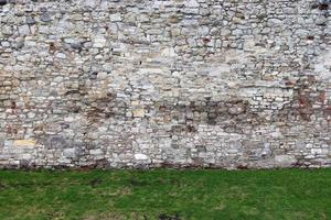 Old brick wall. Texture of old weathered brick wall panoramic background photo