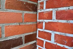 Old brick wall. Texture of old weathered brick wall panoramic background photo