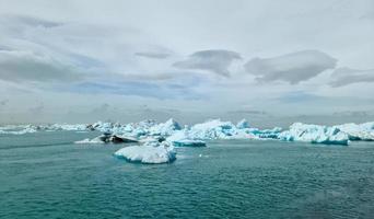 Iceland, Jokulsarlon Lagoon, Turquoise icebergs floating in Glacier Lagoon on Iceland. photo