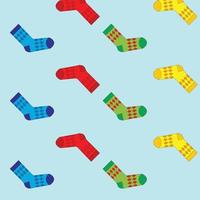 Multicolored socks on a blue background. Socks are scattered vector