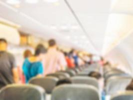 Blurred photo of passengers and seats in an commercial airplane