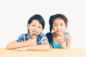 Vintage style photo of asian kids are eating ice cream