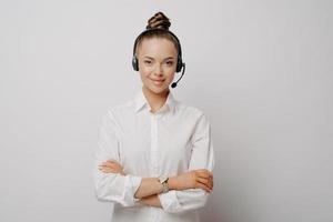 Confident female air traffic controller in white shirt photo