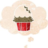 cupcake de dibujos animados y burbuja de pensamiento en estilo retro texturizado vector