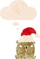lindo oso de dibujos animados con sombrero de navidad y burbuja de pensamiento en estilo retro texturizado vector
