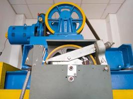 The large circle wheel of the passenger elevator motor in the control room. photo