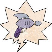 cartoon ray gun and speech bubble in retro texture style vector