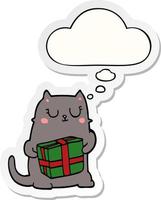 cartoon christmas cat and thought bubble as a printed sticker vector