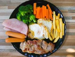 Grilled pork steak with the side dishes. photo