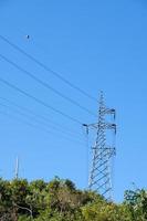 High voltage tower on the high mountain. photo