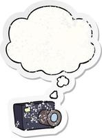 cartoon camera and thought bubble as a distressed worn sticker vector