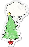 cartoon christmas tree and thought bubble as a distressed worn sticker vector