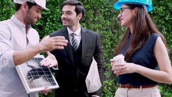 Team engineer discussion about solar panel project together. Concept of green energy video