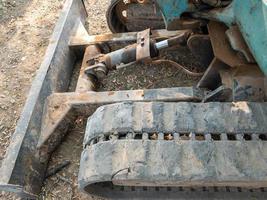 The metal blade of the small excavation for grader the soil. photo