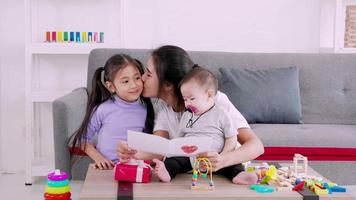 Happy single mom family, cute daughter sends love mom cards to mother and kiss video