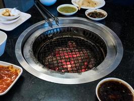 Empty grill stove after the meal time. photo