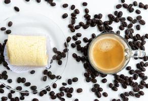 Top view of the espresso shot and soft roll cake. photo