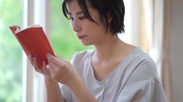 Woman reading at home video